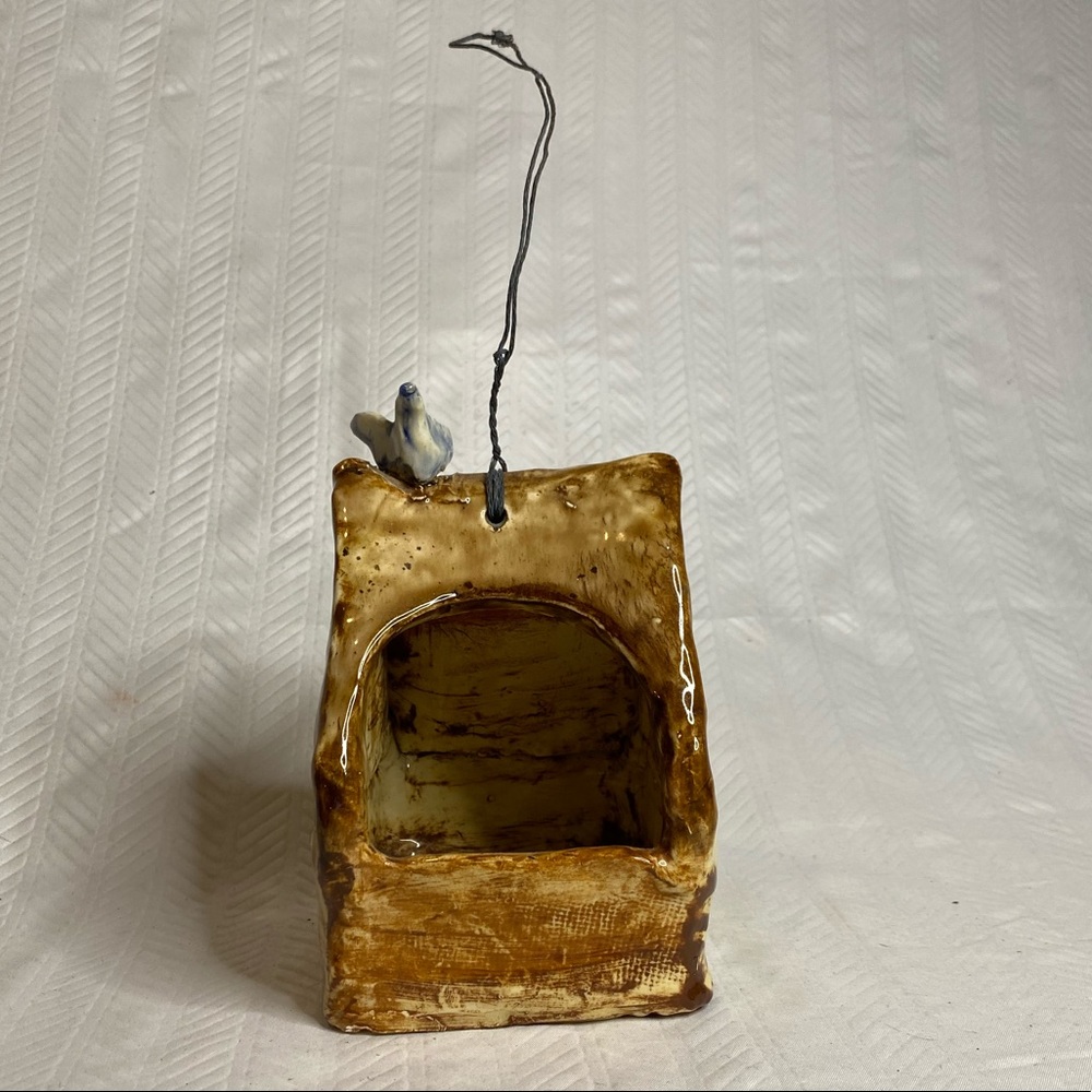 Glazed ceramic hand made bird house.